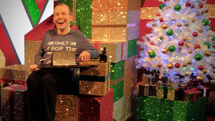 Lee Ridley sat on some presents