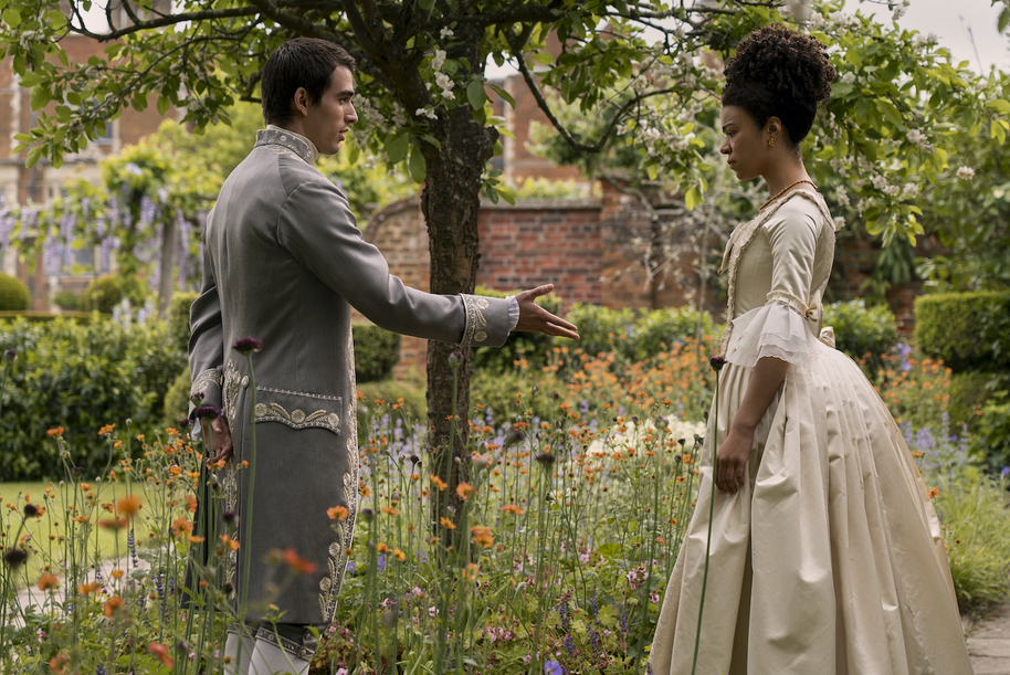 queen charlotte and king george in a flower garden in queen charlotte: a bridgerton story