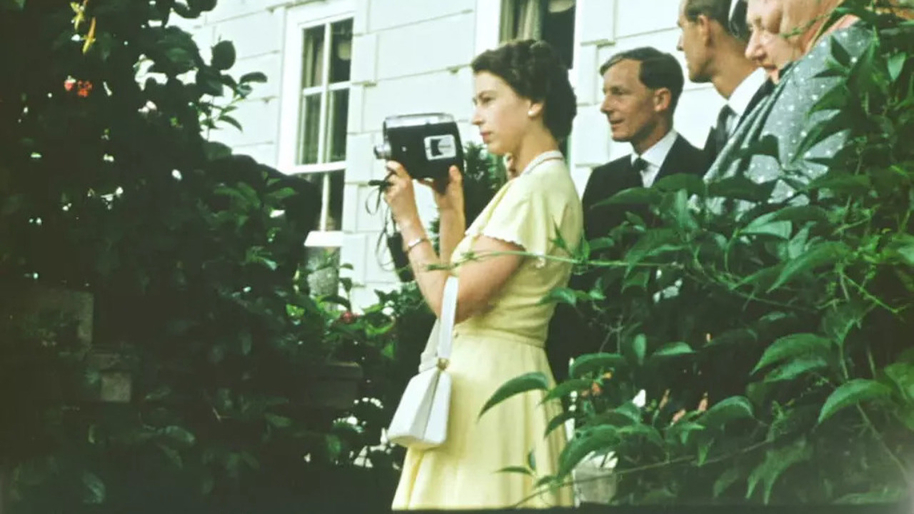 young queen elizabeth ii holding a video camera