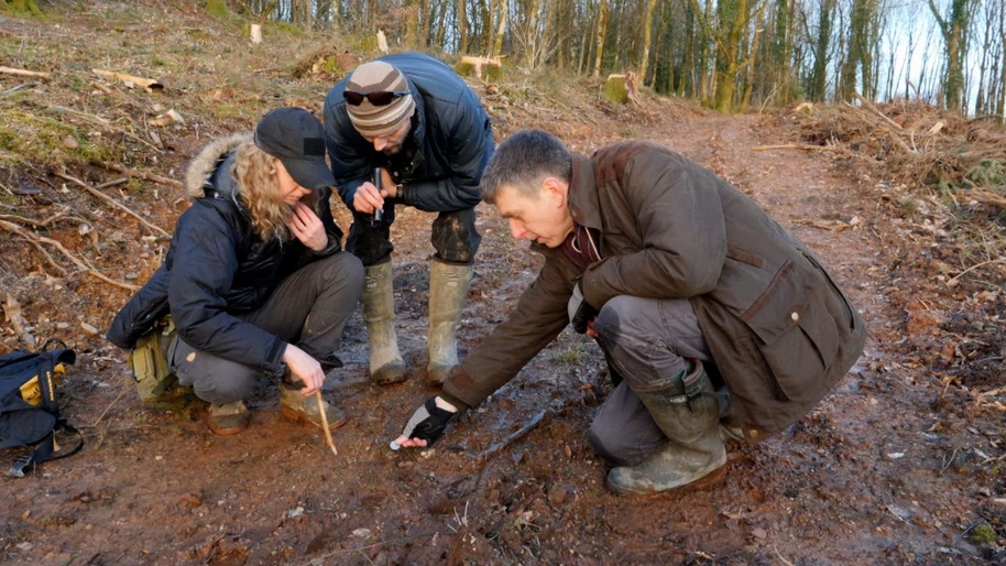 Rick Minter and Rhoda Watkins investigating potential big cat footprints