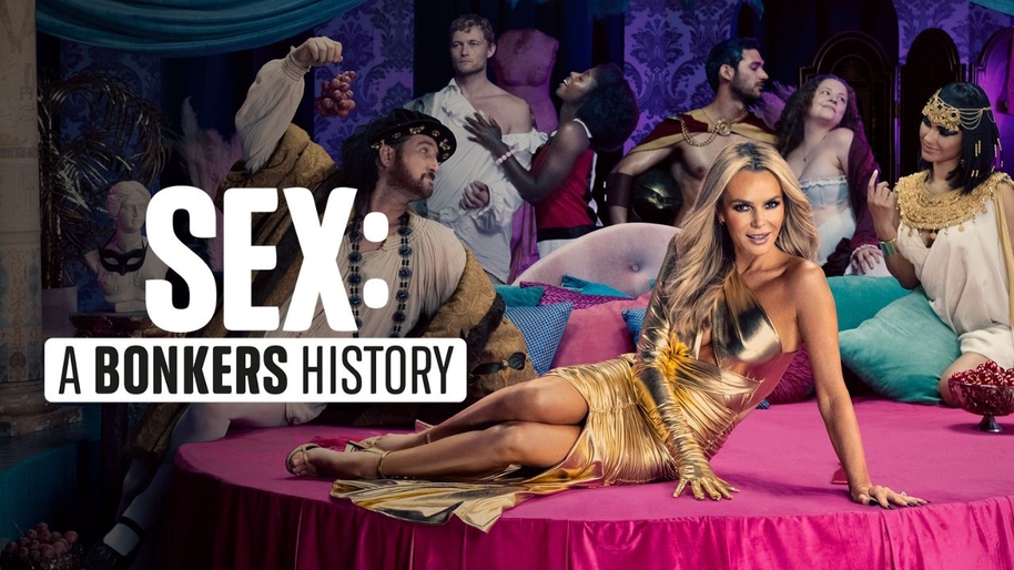 Women in golden dress lying in a pink stage with women posing in the background. Copy that reads "Sex: A Bonkers History"