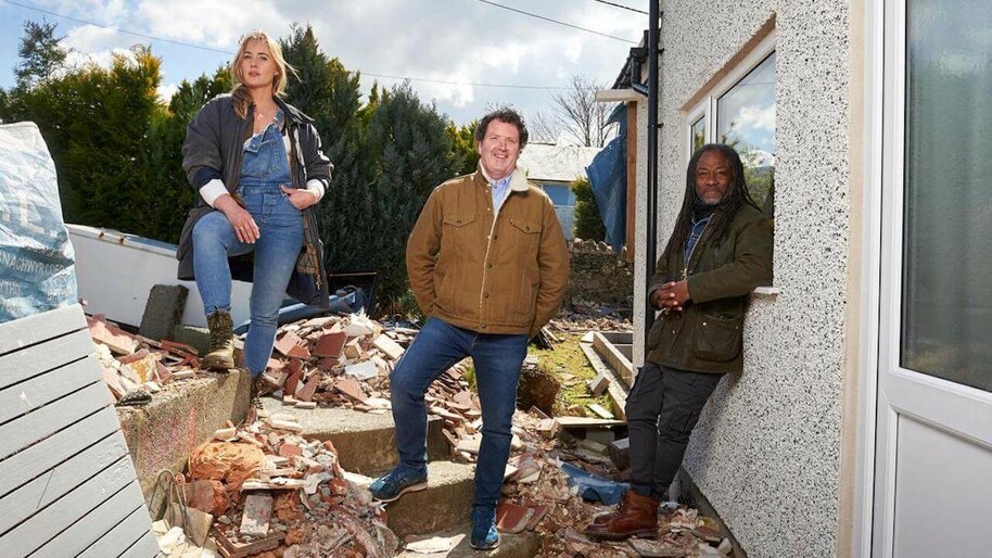 Diarmuid Gavin, Danny Clarke and Penny Lamb standing in rubble