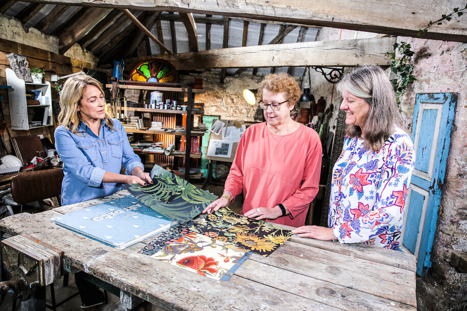 sarah beeny looking at wallpaper samples