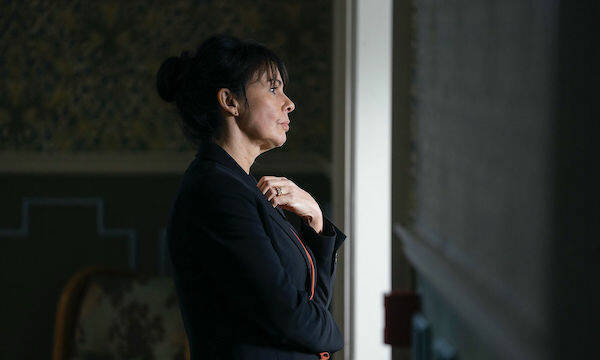 Penance star Julie Graham stares out window