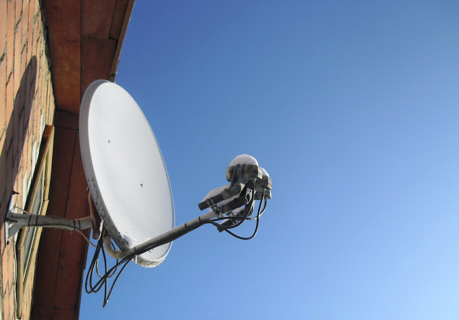 satellite dish attached to a house