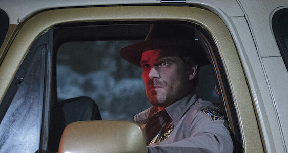 jim hopper in police car