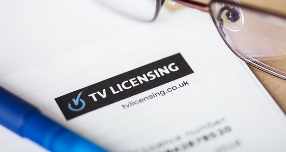 stock image of a tv licensing letting with some reading glasses