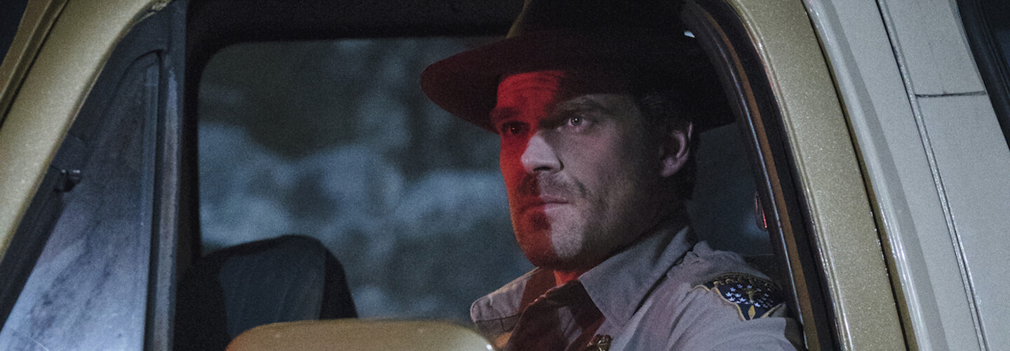 jim hopper in police car