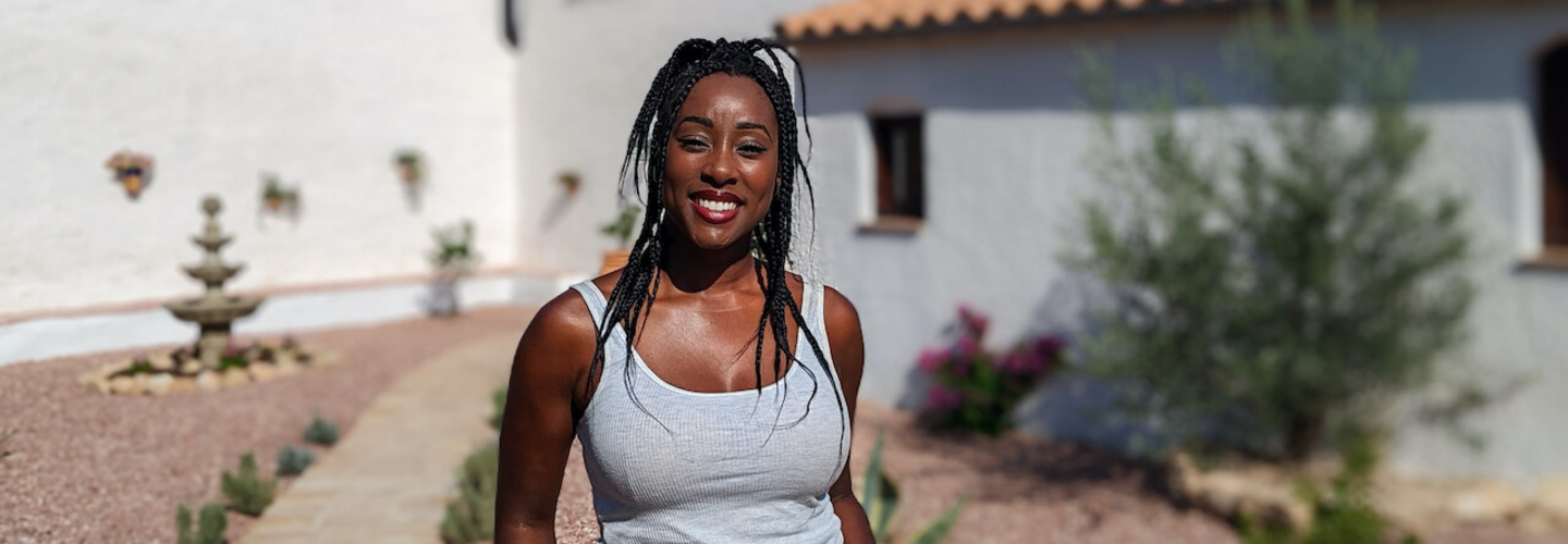 scarlette douglas smiling in front of a villa