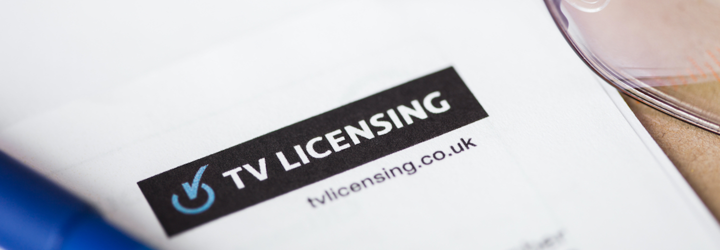 stock image of a tv licensing letting with some reading glasses