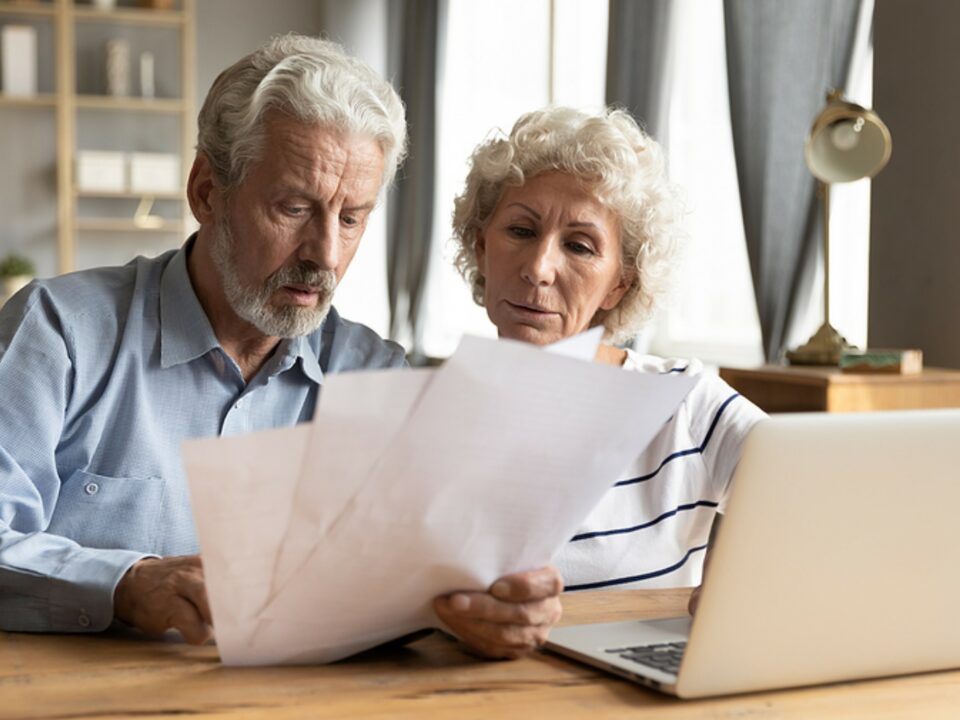 Senior couple looking at paperwork