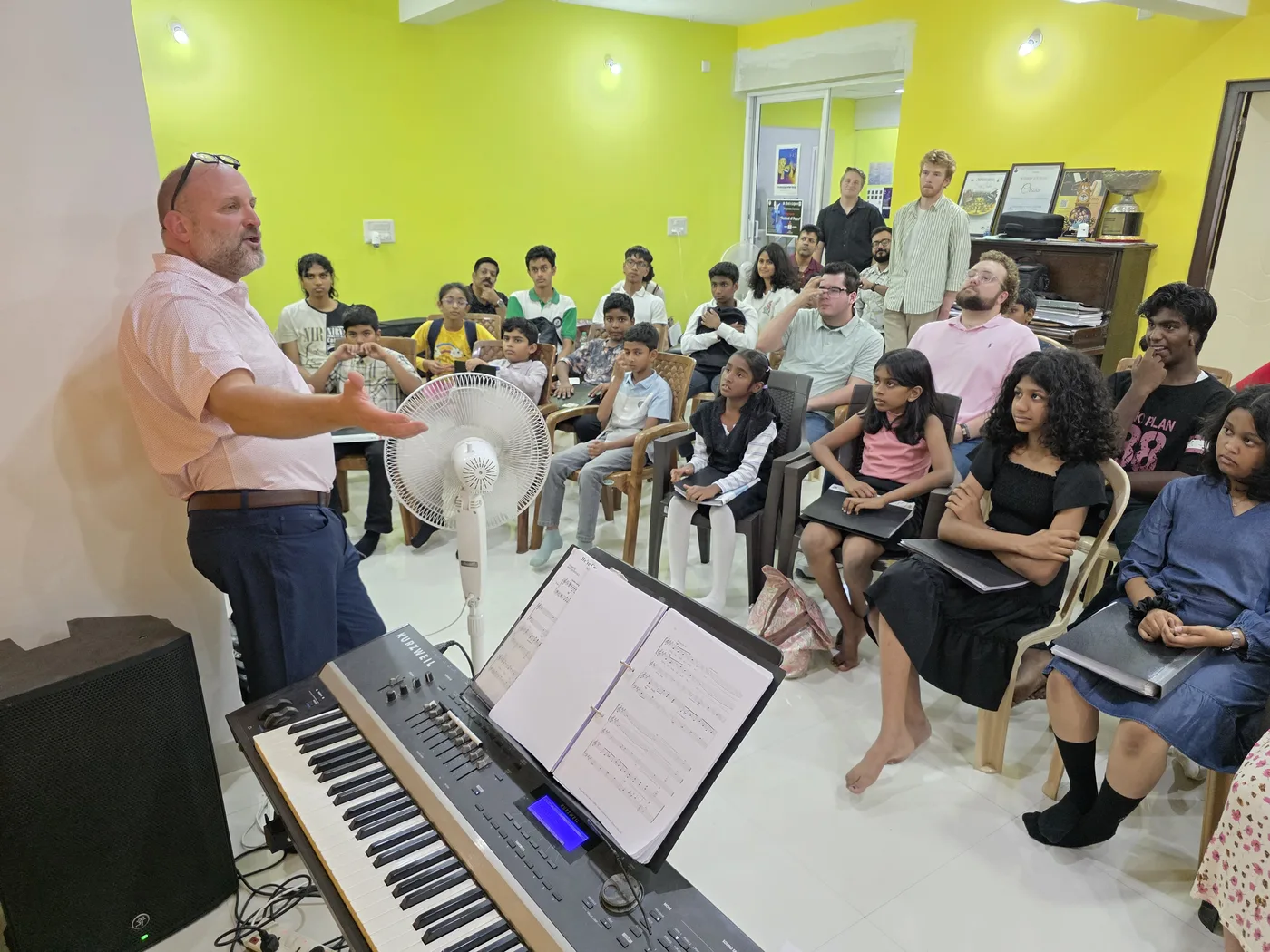 Joseph Bolin leading the choir session during the CBU music workshop at Fingersmith's Garage, Bangalore, June 2026