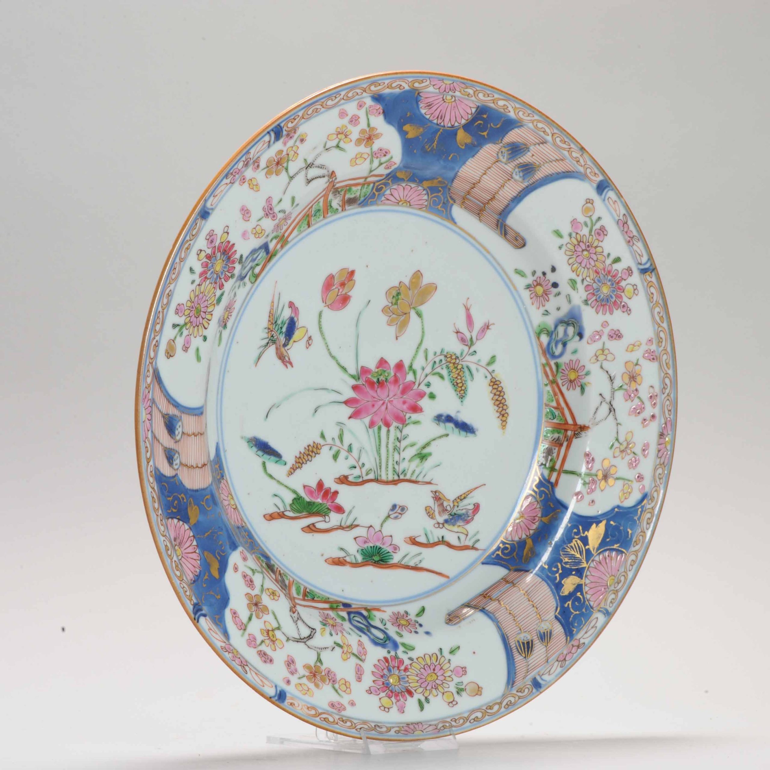 A Chinese Famille Rose dish with Duck Prunus Lotus Pond Garden Kangxi/Yongzheng