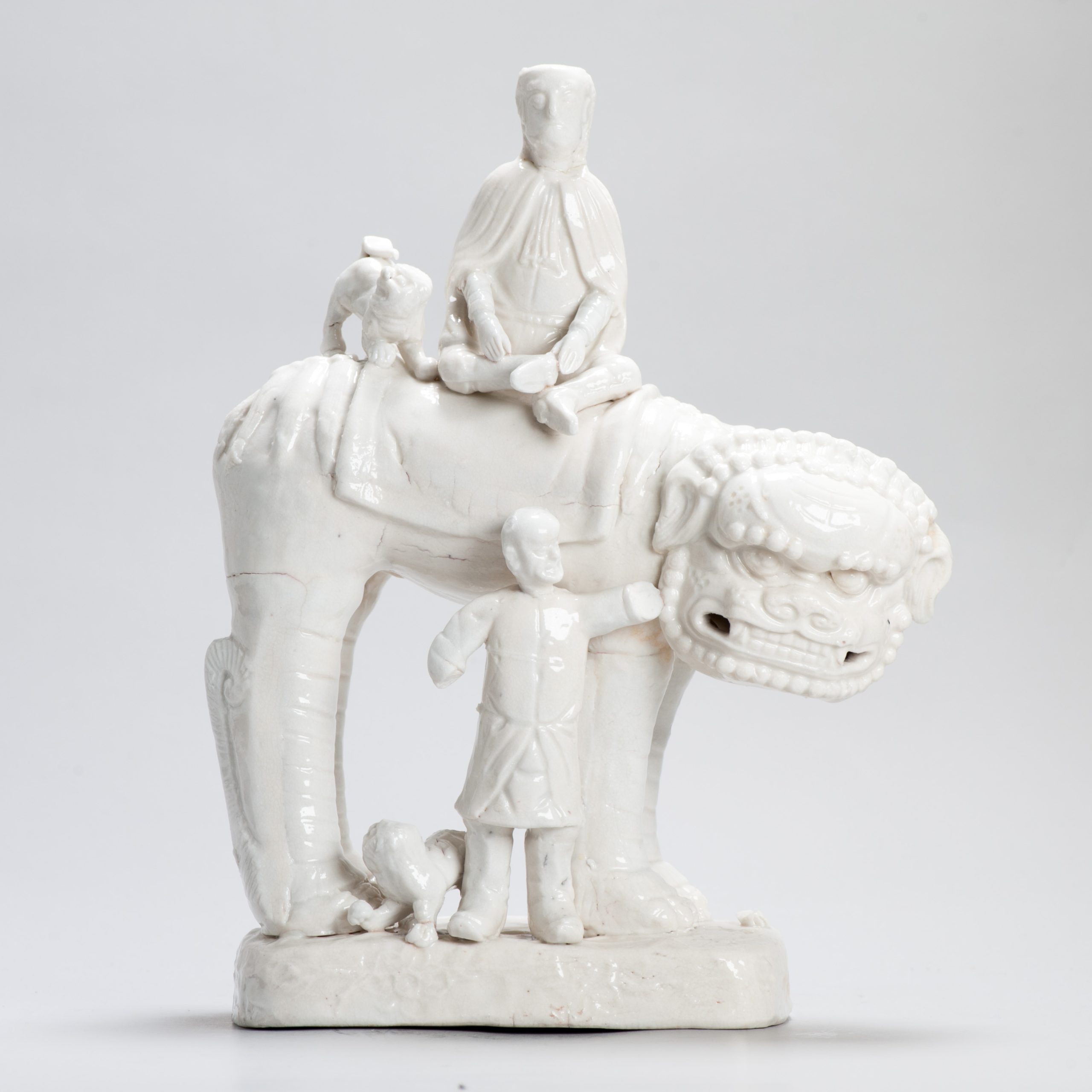 Large 17th C Dehua Blanc de Chine European figure and Lion Kangxi period Chinese