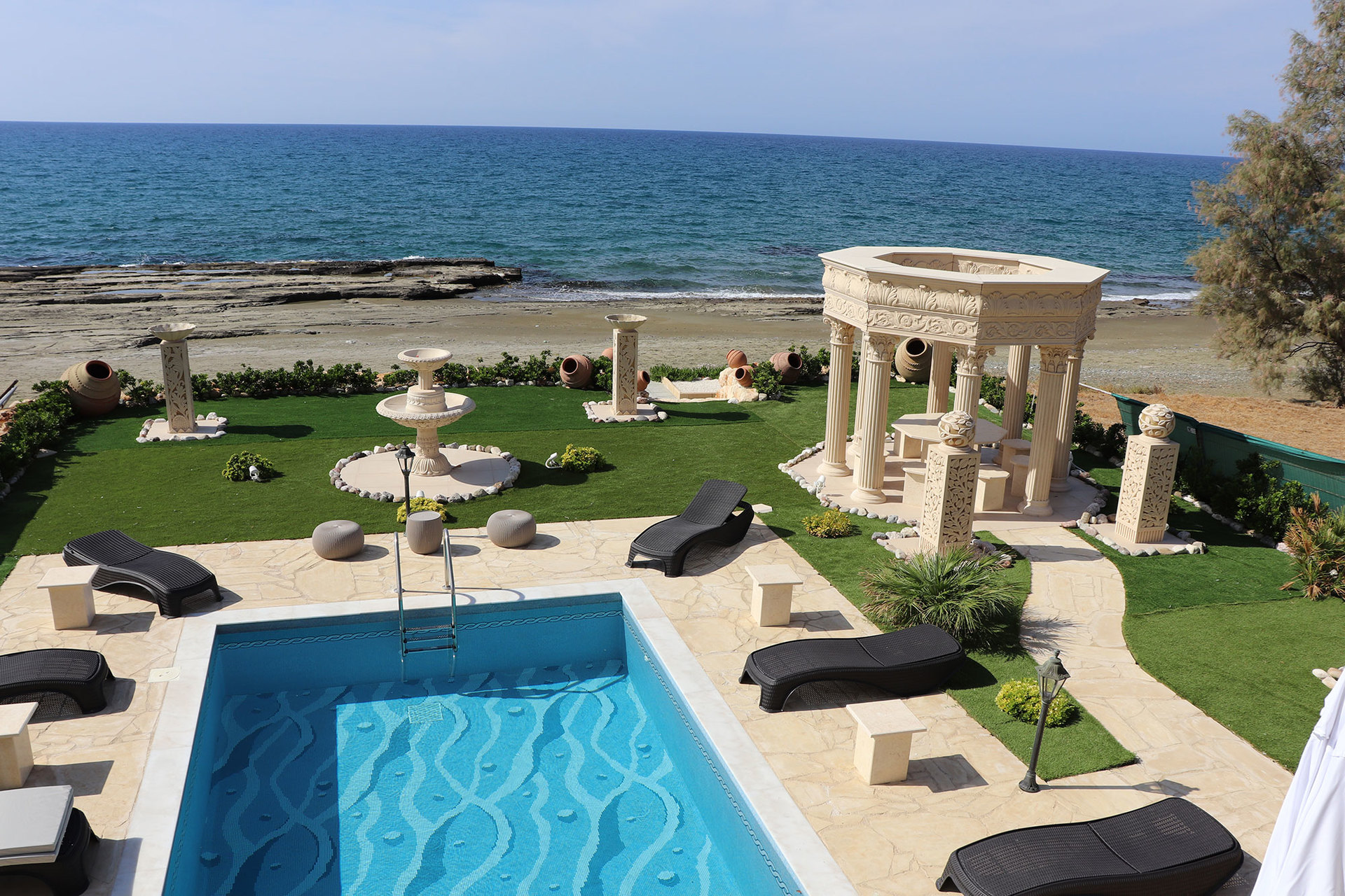 Sun-soaked luxury villa in Cyprus with private pool and coastal Mediterranean views.