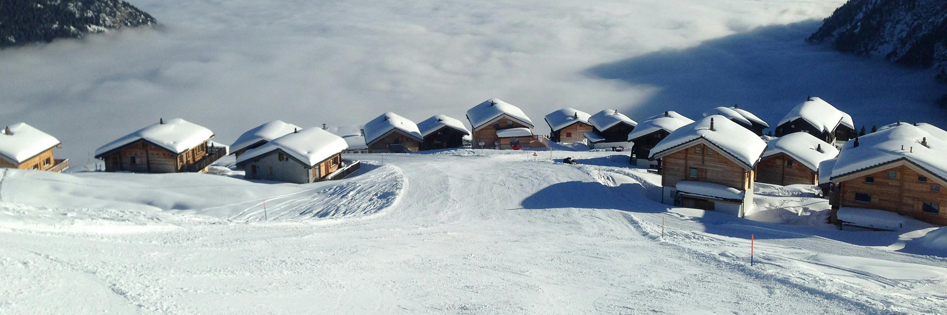 Snow Covered luxury villas in Switzerland with alpine sauna, stone fireplaces and high-altitude stillness.