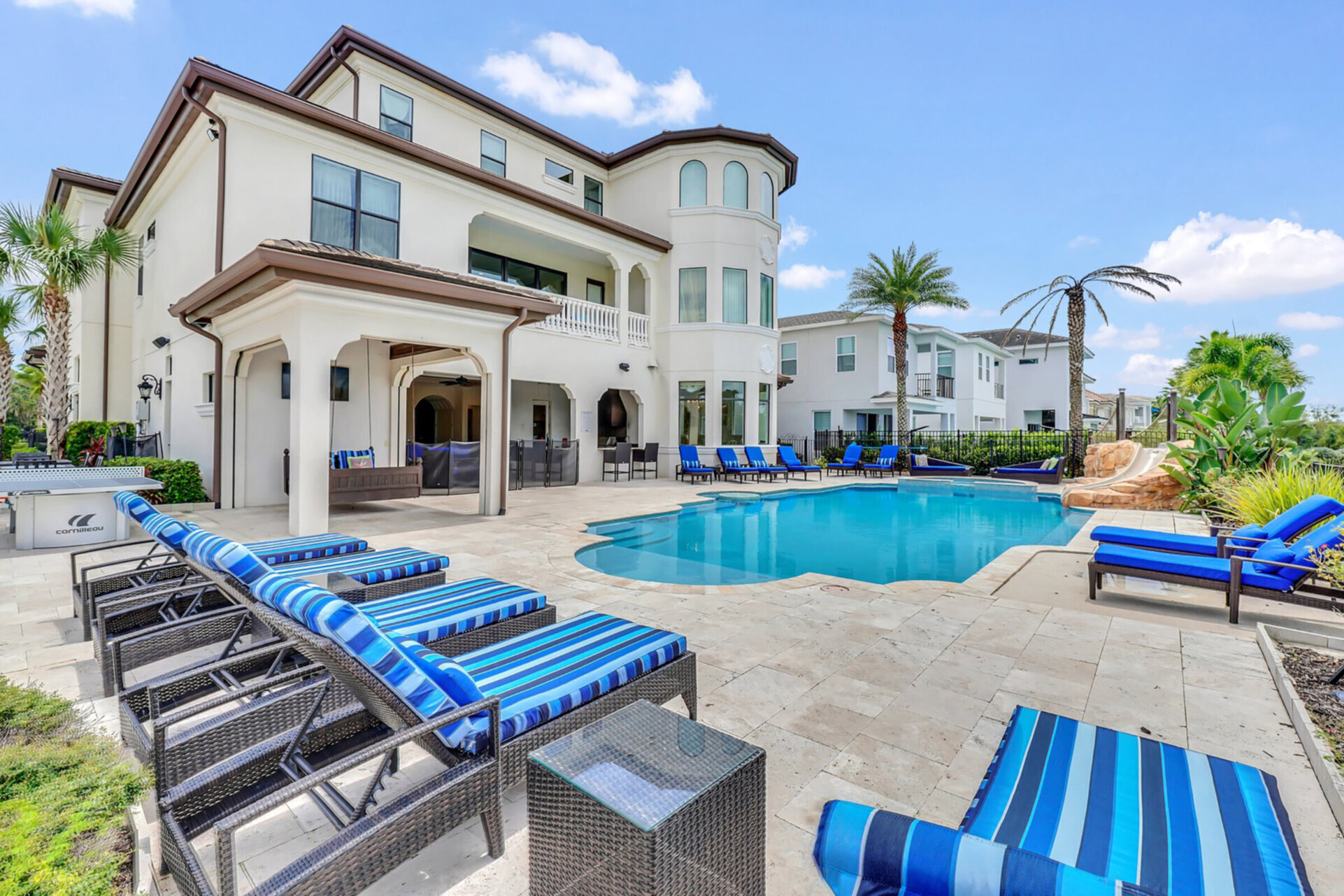 A magnificent multi-level pool and spa at an exquisite luxury villa in us, featuring contemporary architecture and expansive outdoor living spaces.