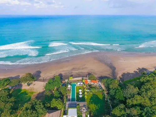 Beachfront Bali villa in Seminyak featuring a private terrace and sweeping views of the Indian Ocean.