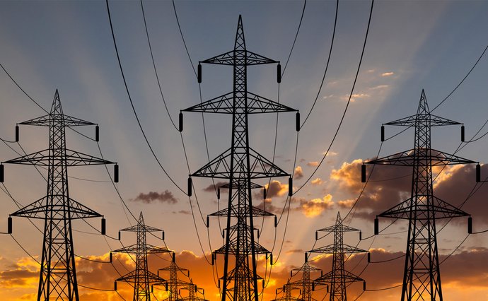 Power lines against evening sky