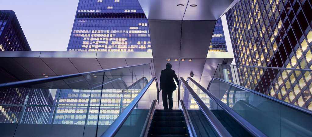 cityscape and person on escalator 2