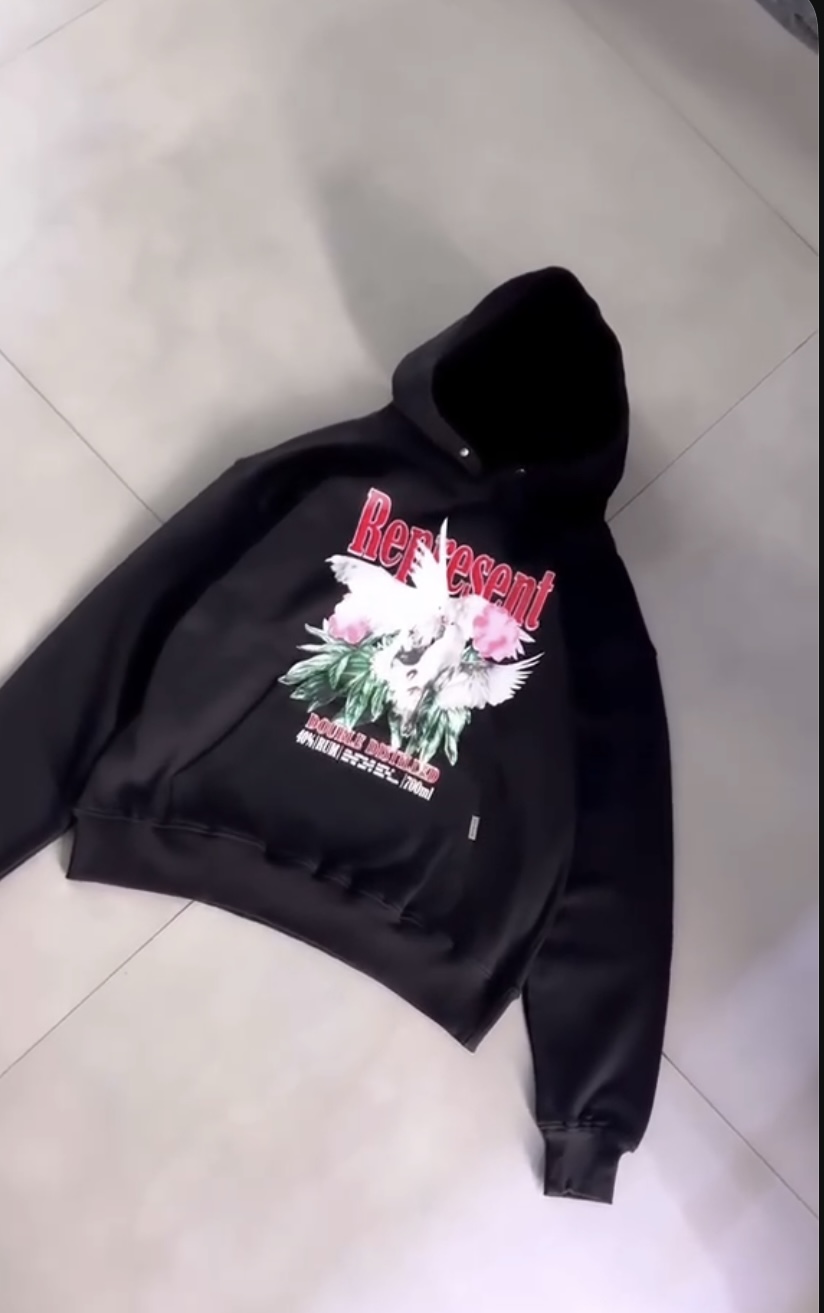 Black hoodie with red text and angel graphic on chest