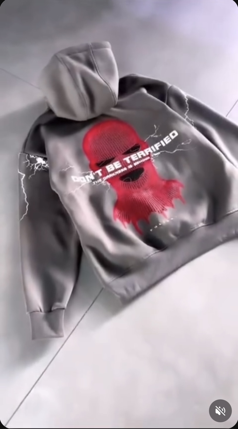 Gray hoodie with red balaclava graphic and Don't Be Terrified back text