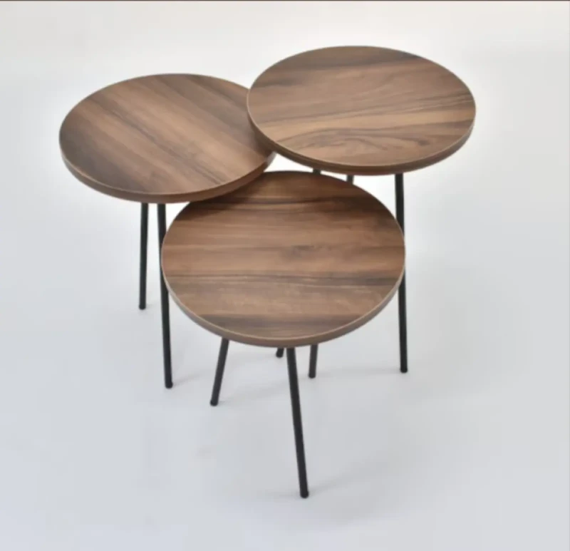 A Set of Wooden Circular Tables With Stainless Legs