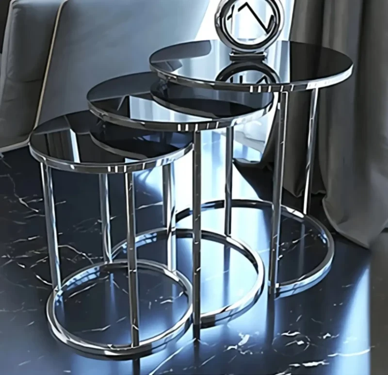 A set of circular metal side tables