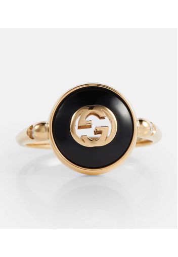 Ring Interlocking G aus 18kt Gelbgold mit Onyx und Diamanten