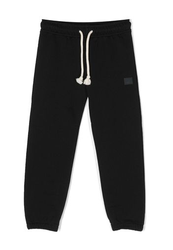 Acne Studios logo-patch detail track pants - Schwarz