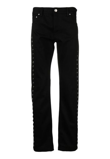 Alexander McQueen metal-eyelet detail jeans - Schwarz