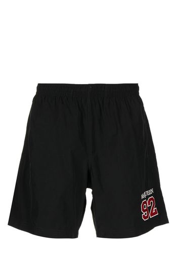 Alexander McQueen embroidered-logo swim shorts - Schwarz