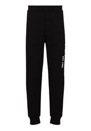 Alexander McQueen Jogginghose mit Graffiti-Print - Schwarz