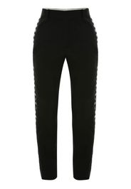 Alexander McQueen eyelet-detail slim-cut trousers - Schwarz