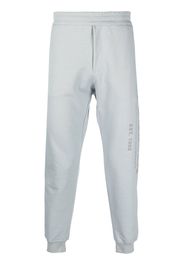 Alexander McQueen logo-print cotton track pants - Grau