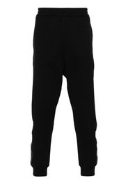 Alexander McQueen Tapered-Jogginghose mit Logo-Streifen - Schwarz