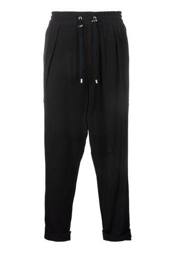 Balmain slouchy crepe tapered-leg track pants - Schwarz