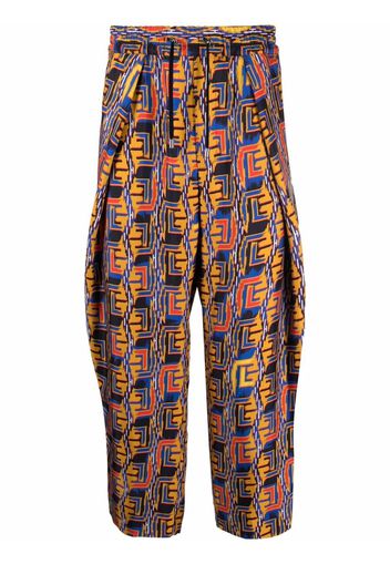 Balmain graphic-print cropped trousers - Blau