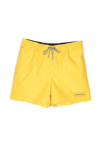 Calvin Klein logo-waistband swim shorts - Gelb