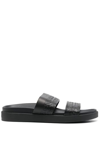 Calvin Klein embossed-logo leather slides - Schwarz