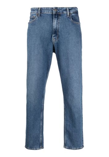 Calvin Klein logo-patch mid-rise tapered jeans - Blau