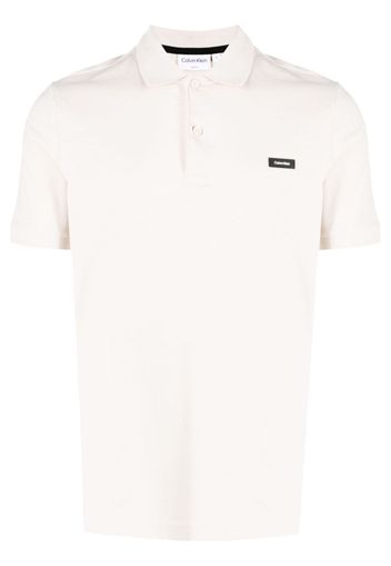 Calvin Klein logo-patch piqué polo shirt - Nude