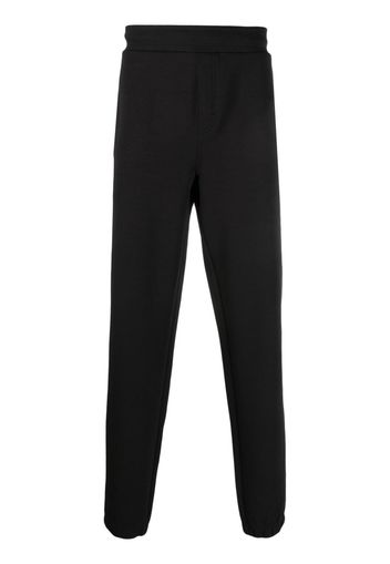 Calvin Klein logo-debossed track pants - Schwarz