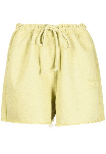 GANNI drawstring-waist raw-edge shorts - Grün