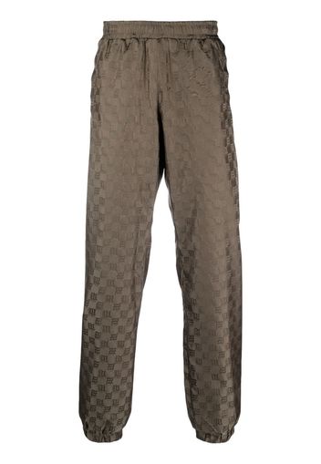 MISBHV monogram-pattern trackpants - Grün