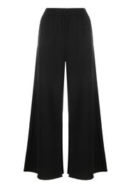 MM6 Maison Margiela low-rise wide-leg track pants - Schwarz