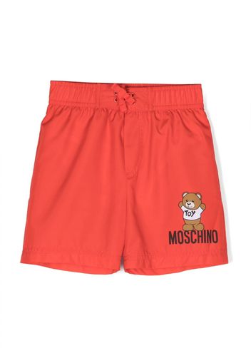 Moschino Kids logo-print swim trunks - Rot