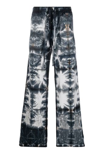 Nahmias graphic-print cotton trousers - Blau