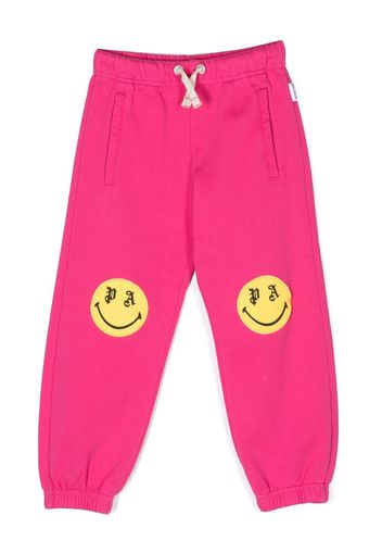 Palm Angels Kids smiley print track pants - Rosa