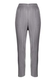 Pleats Please Issey Miyake slim-cut micro-pleated trousers - Grau